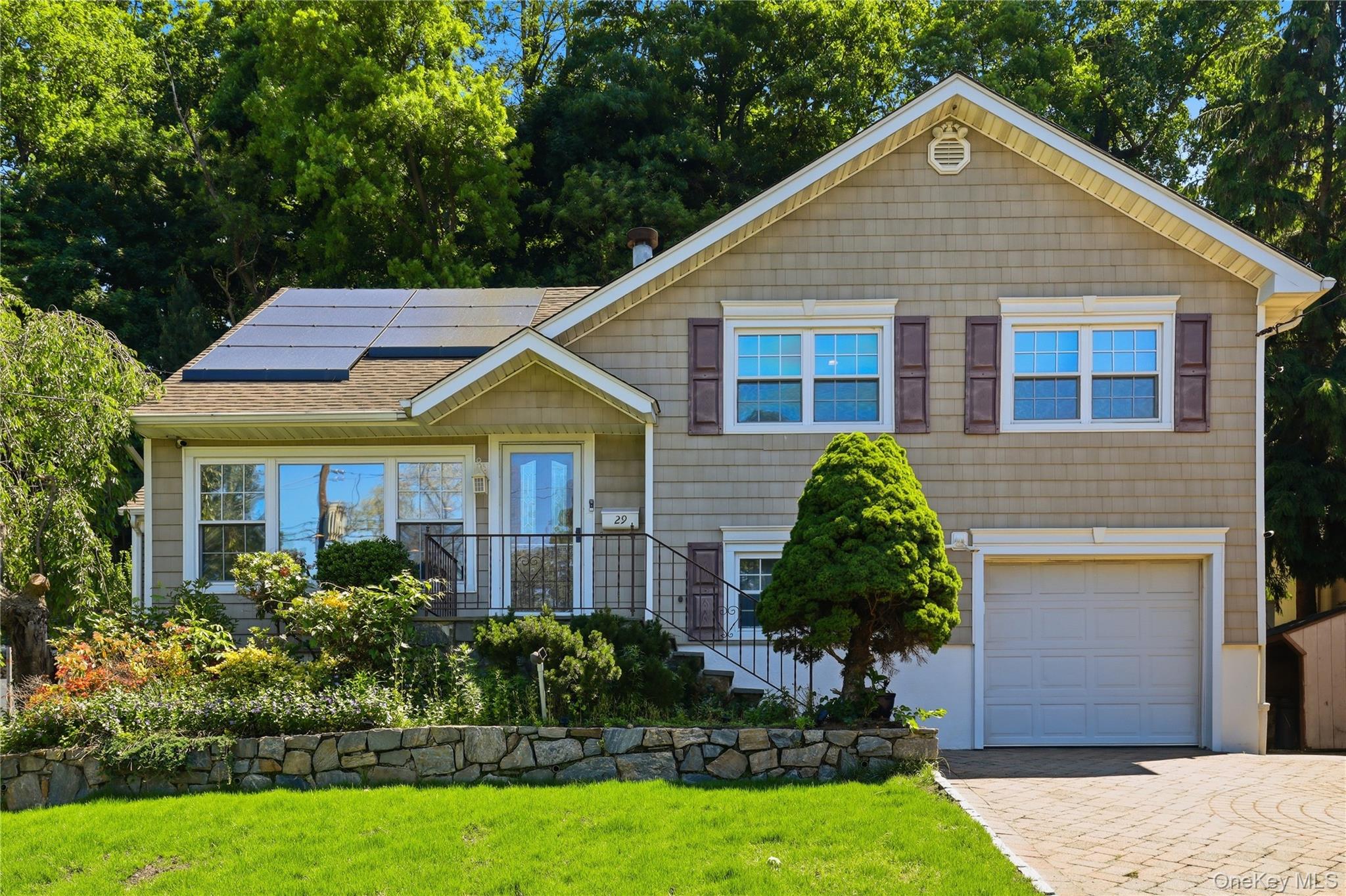 Tucked away on a quiet street in the desirable Westchester Hills area...