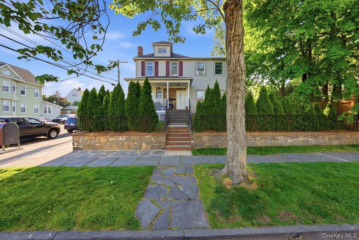 Stunning Legal 2-Family Home nestled on a beautifully maintained corne...