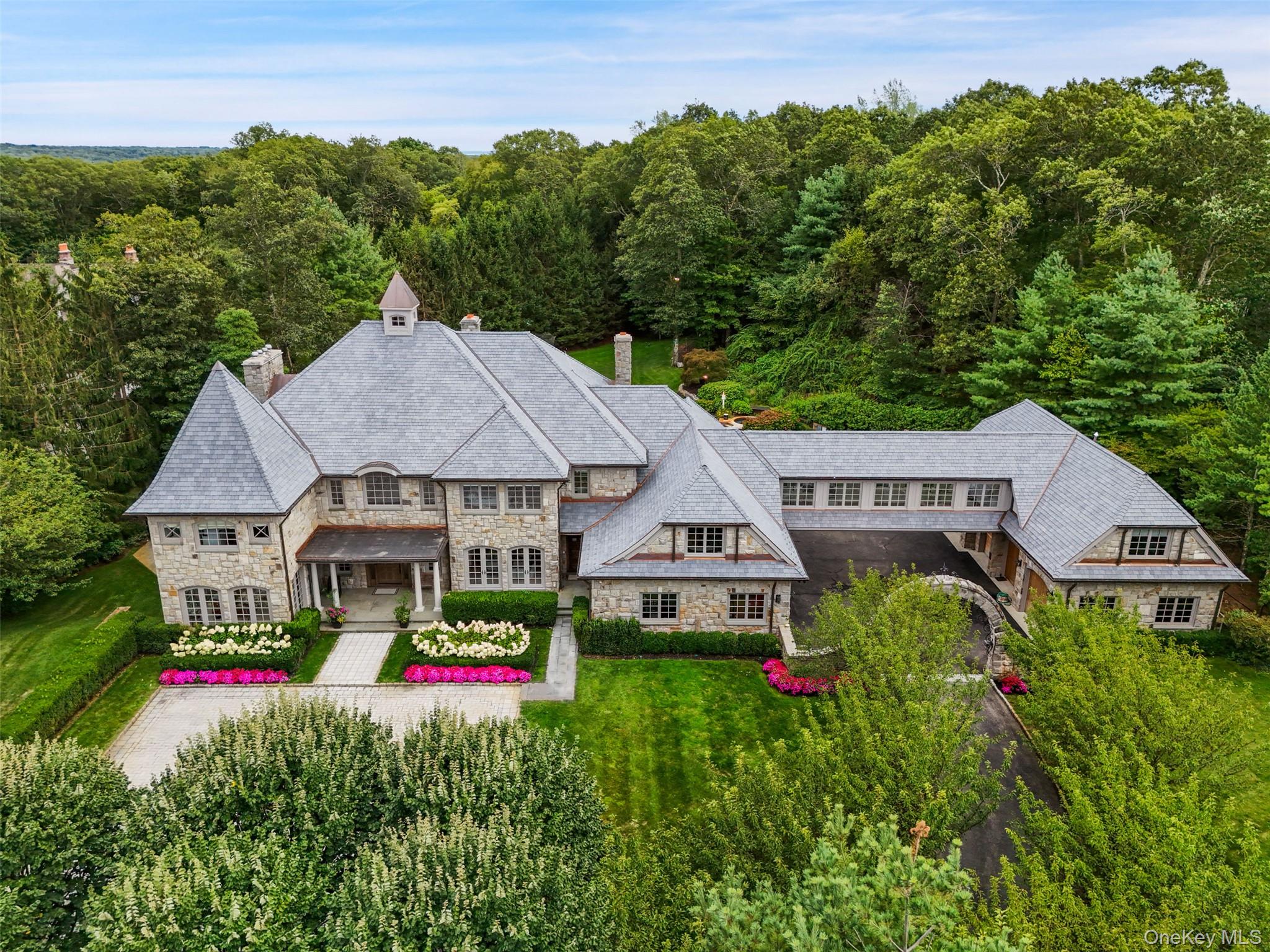 Set majestically on nearly three gated acres in Armonk’s coveted Wrigh...