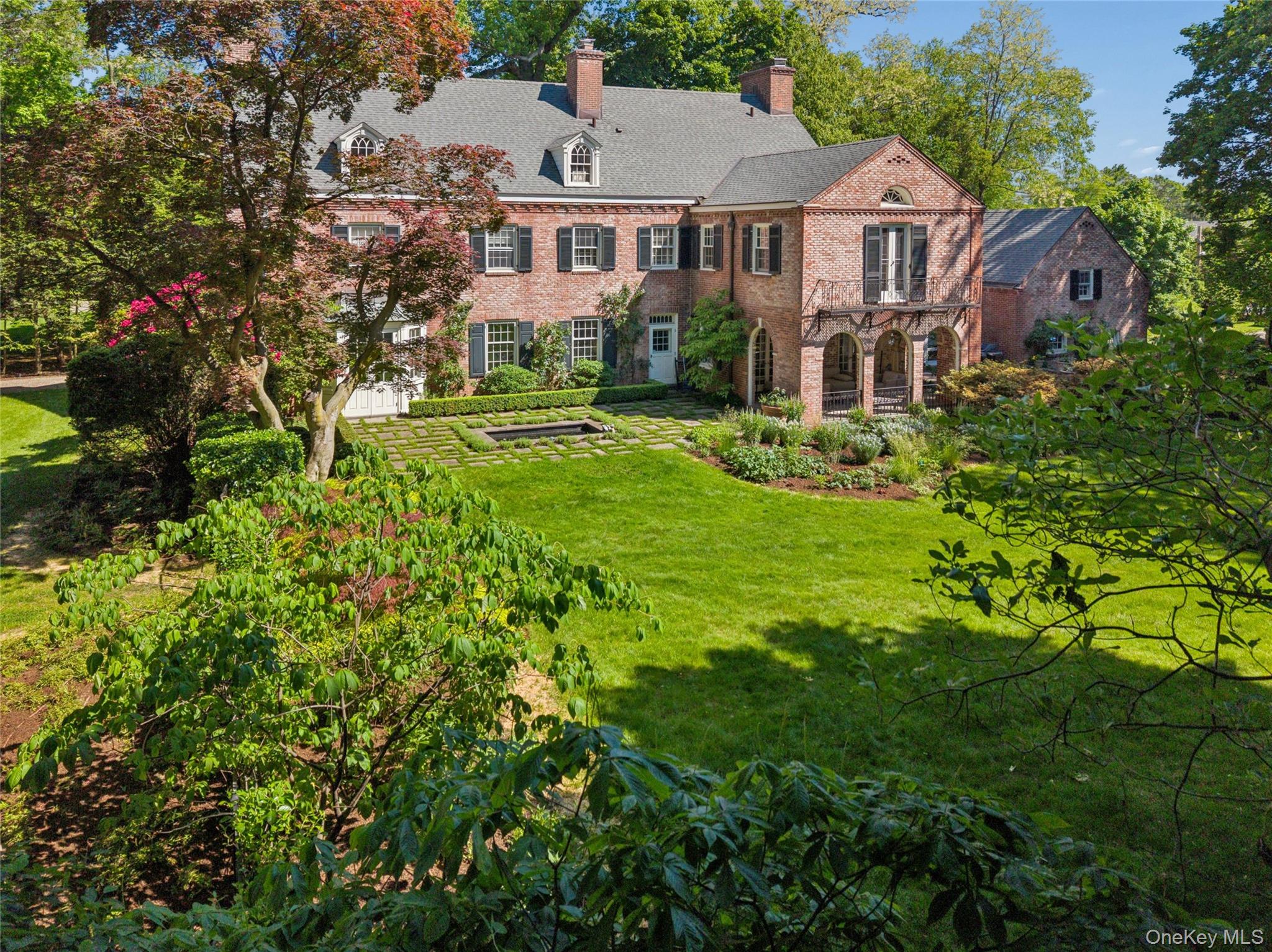 Set on 3/4 of an acre of level, lushly landscaped grounds in the heart...