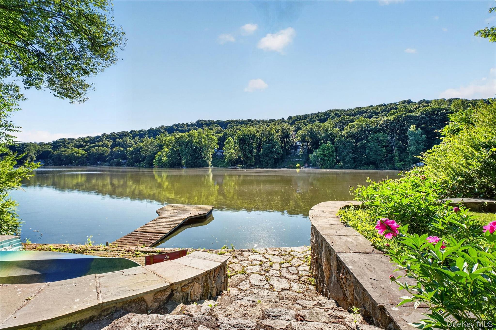 Tucked along the shoreline with sweeping water views and your own priv...