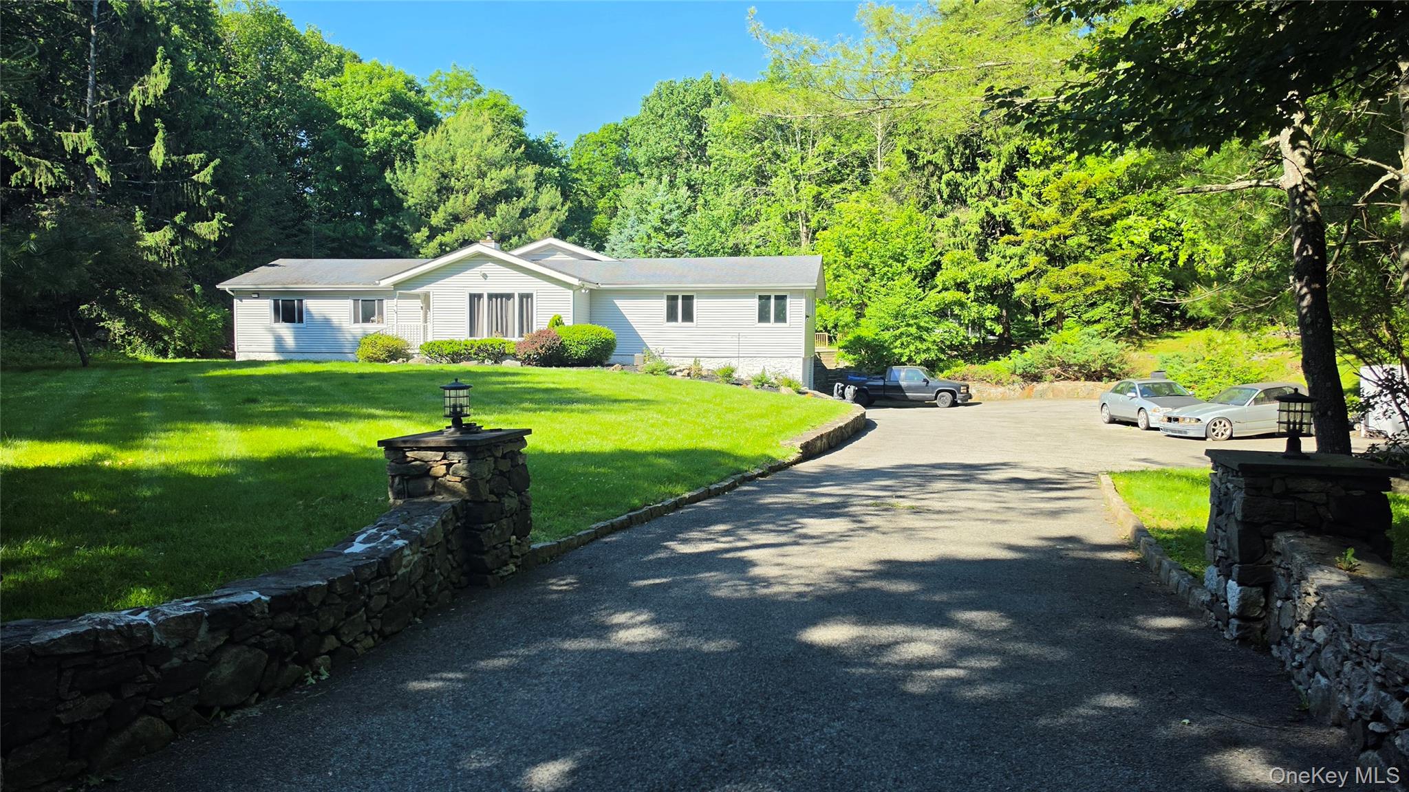 Set on two peaceful acres in the desirable New Castle area, this thoug...