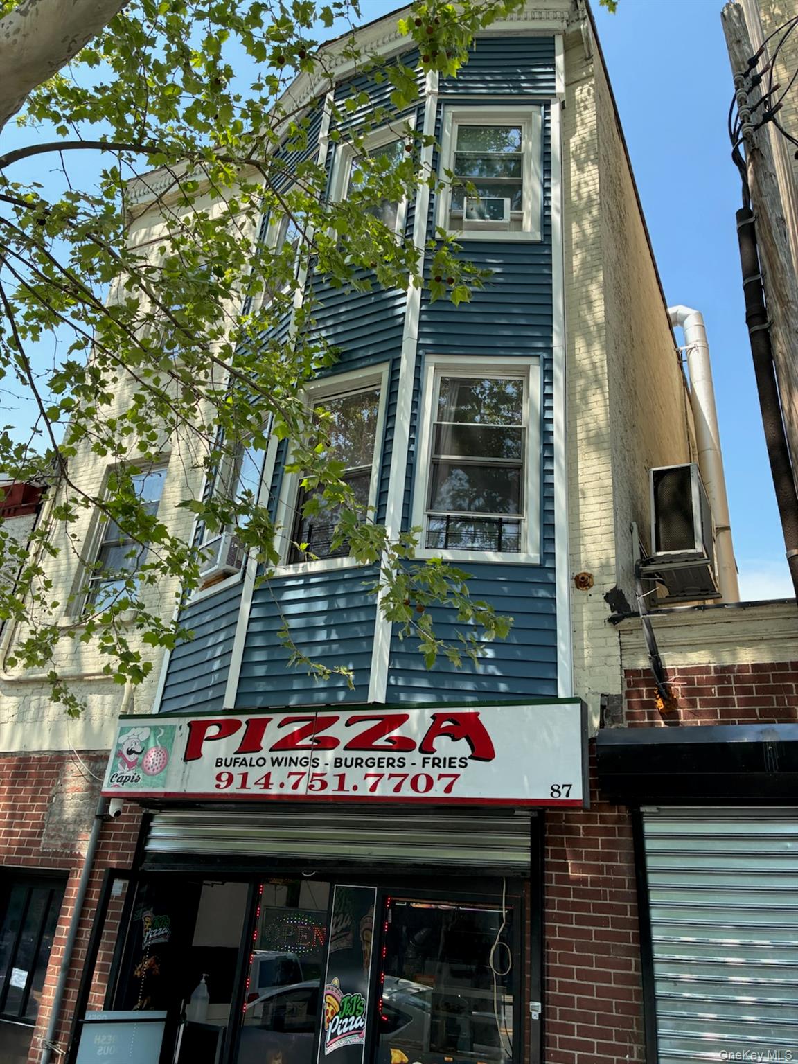 Property features 4 residential units and 1 commercial used as a pizze...