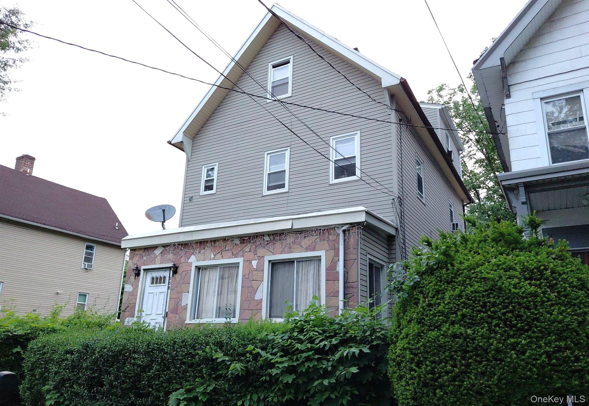 This Colonial Style Home Features 5 Bedrooms, 2 Full Baths and Formal...
