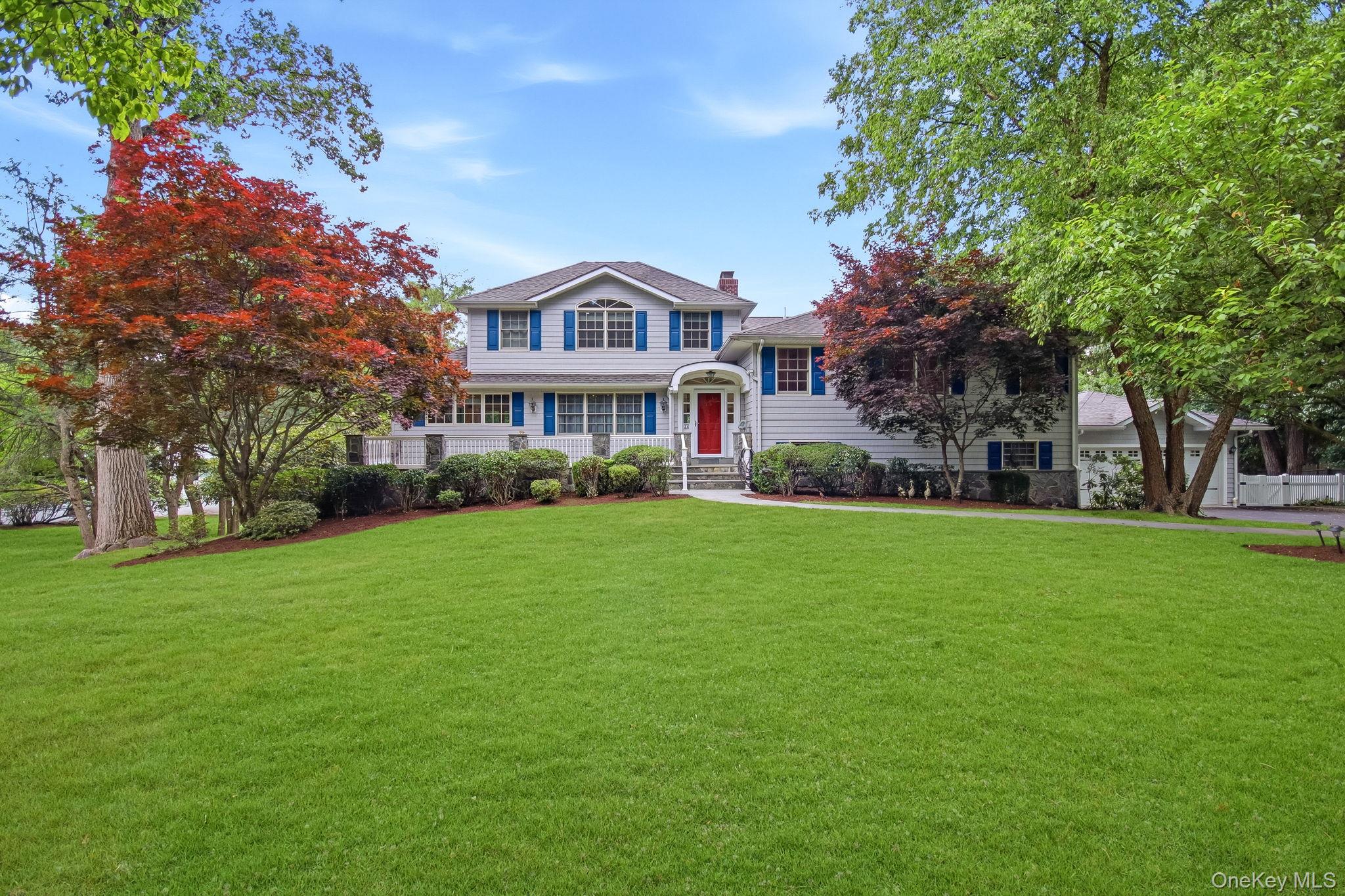 Welcome to 26 Century Ridge Road, a charming and expansive split-level...