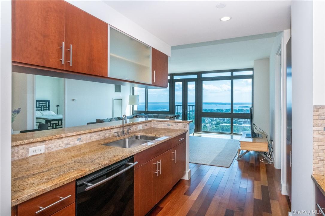 Perched on the 26th floor at Trump Plaza New Rochelle, this spacious t...