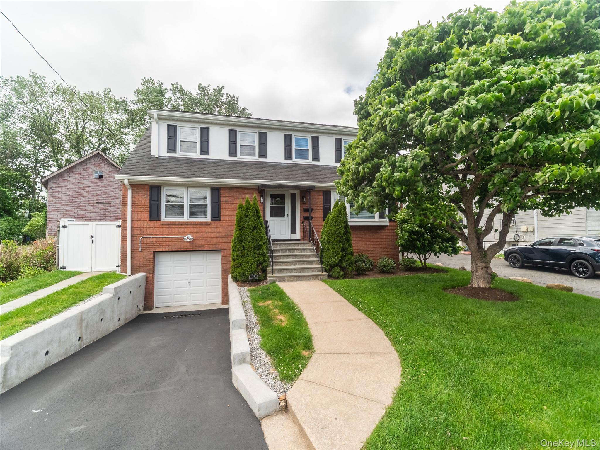 A rare gem. This custom- built two-family home showcases exceptional c...