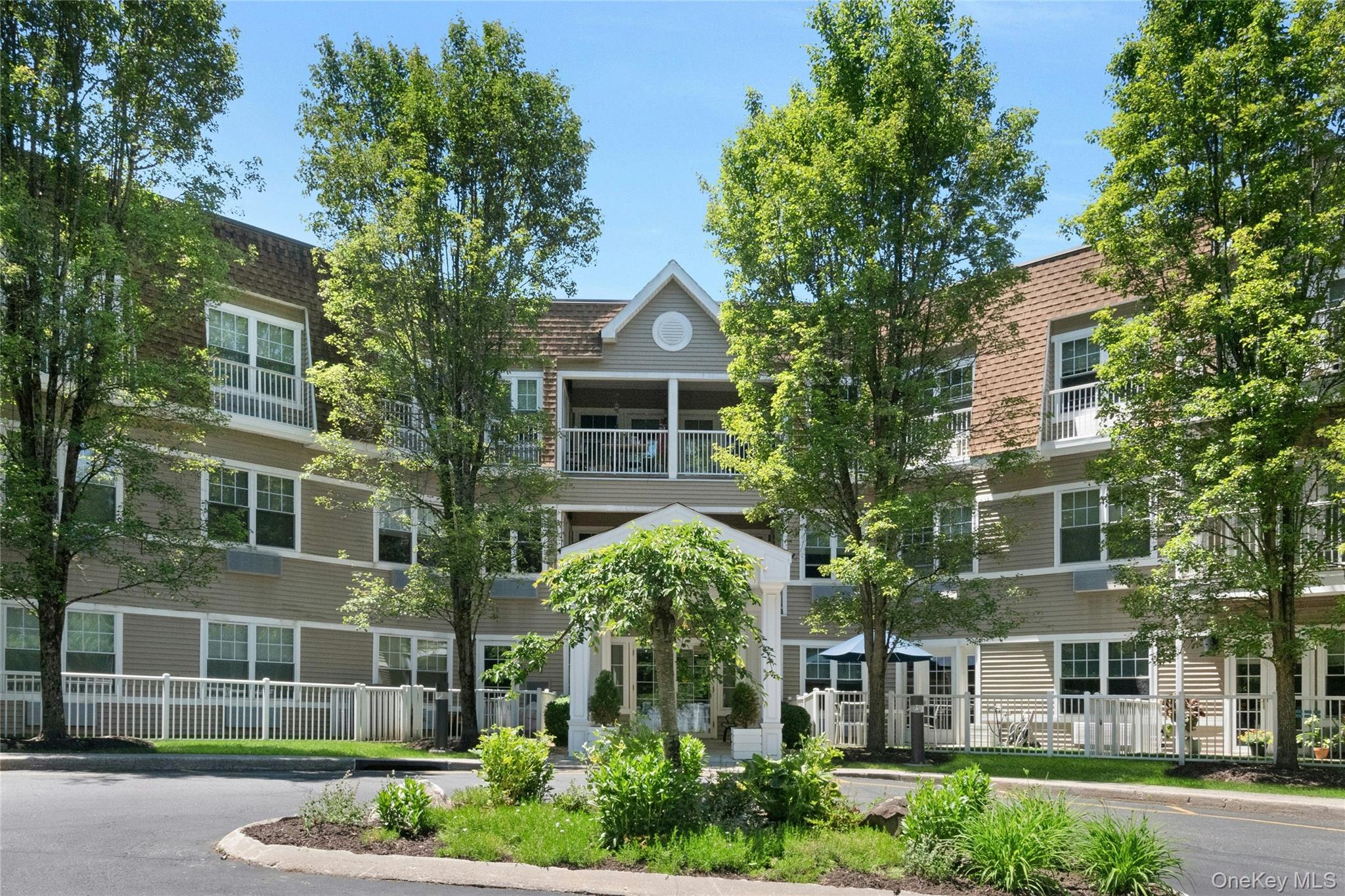 Welcome home to this pristine top floor 2-bedroom, 2-bath end unit con...