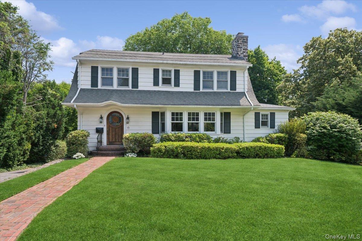 Nestled on a picturesque, curving, tree-lined street in the heart of c...