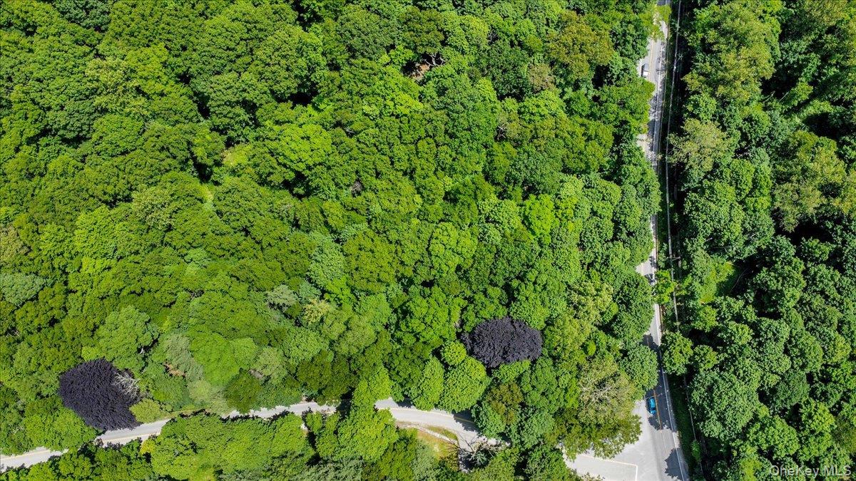 Rare 4+ acre corner parcel in the Town of Bedford offering privacy, na...
