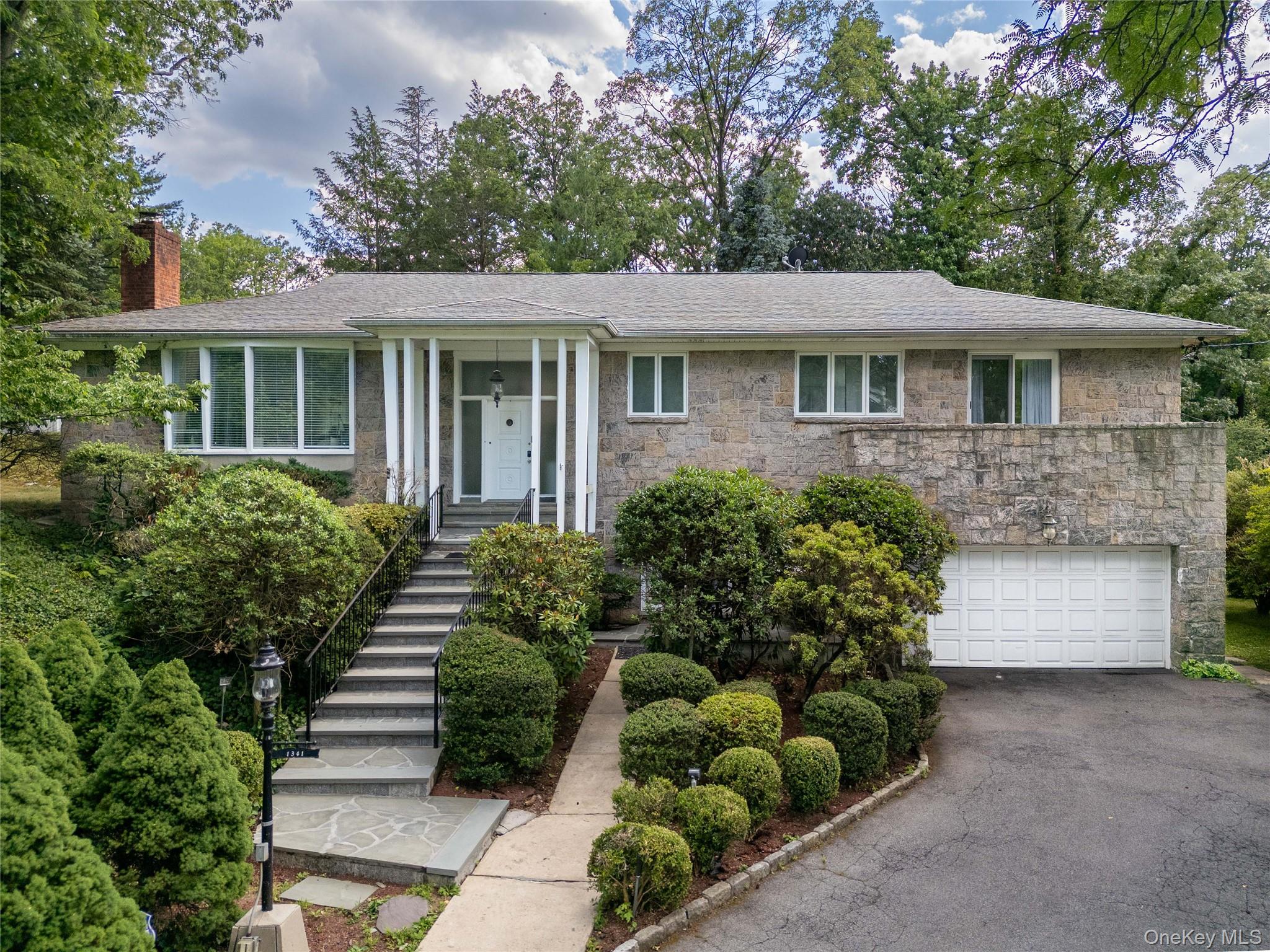 Welcome to this magnificent stone home in the heart of the Estate Sect...