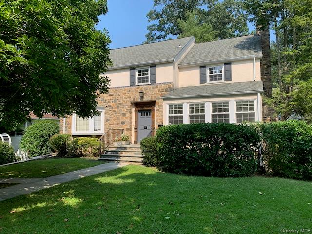 Bright four bedroom center hall colonial on one of the prettiest stree...