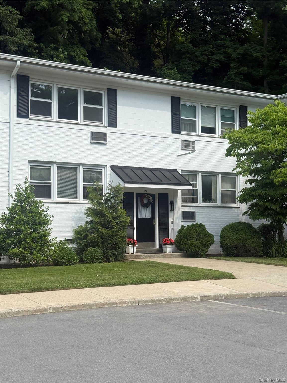 Welcome to Unit 27D at Rye Ridge Condominium, a bright and beautifully...
