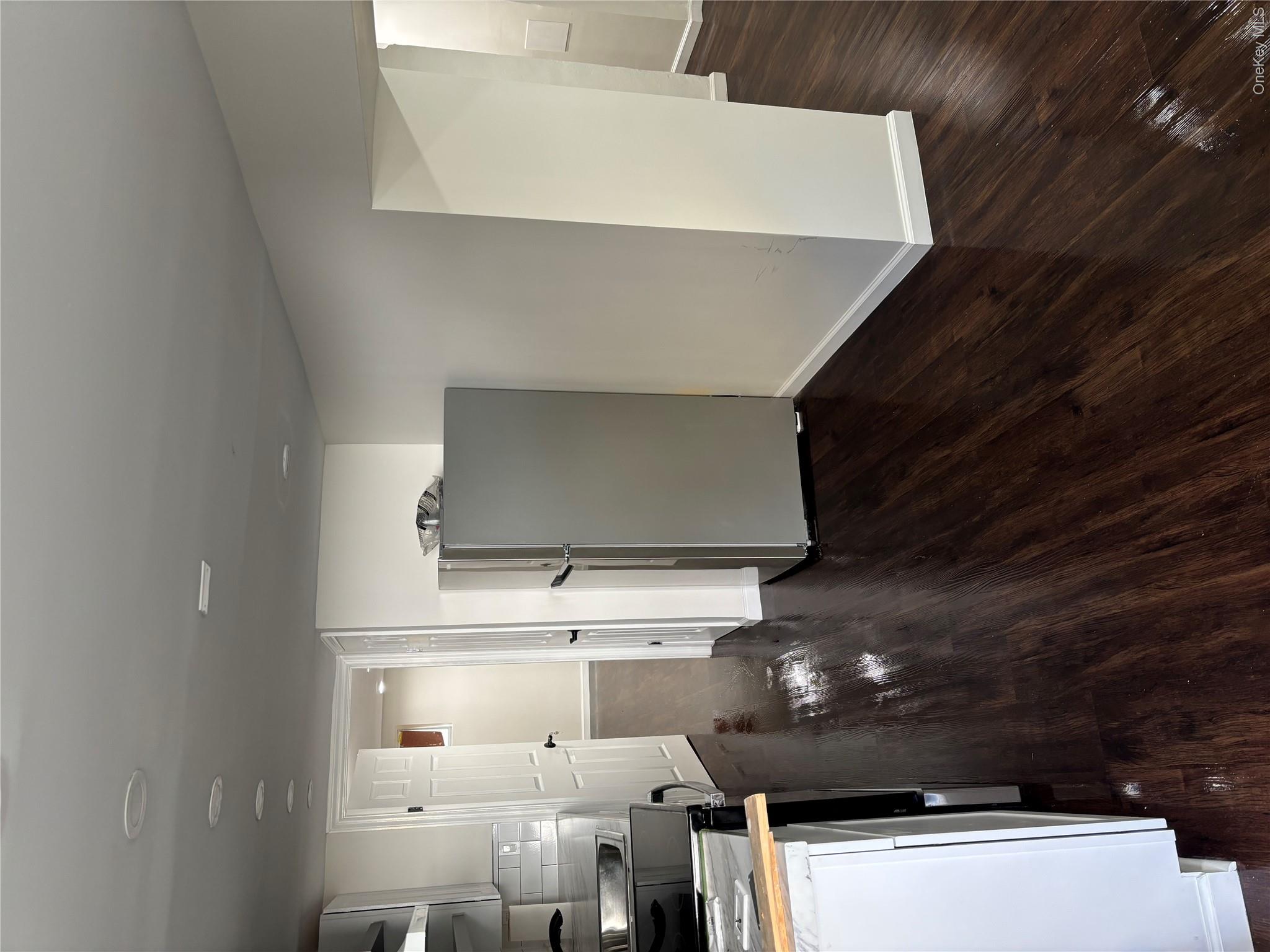 This renovated finished basement features a modern design, complete wi...