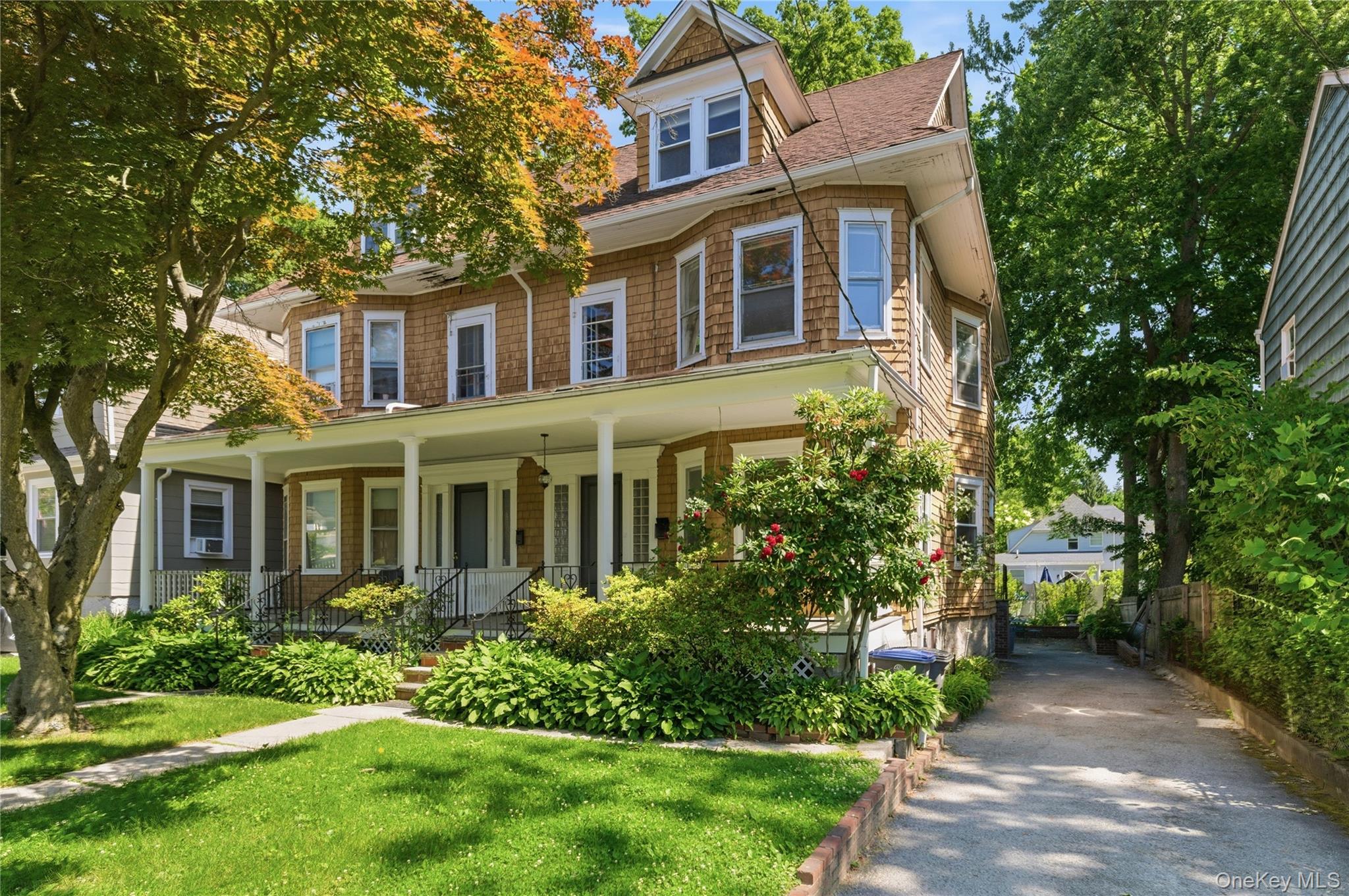 Nestled in the heart of White Plains, this timeless Colonial Revival b...