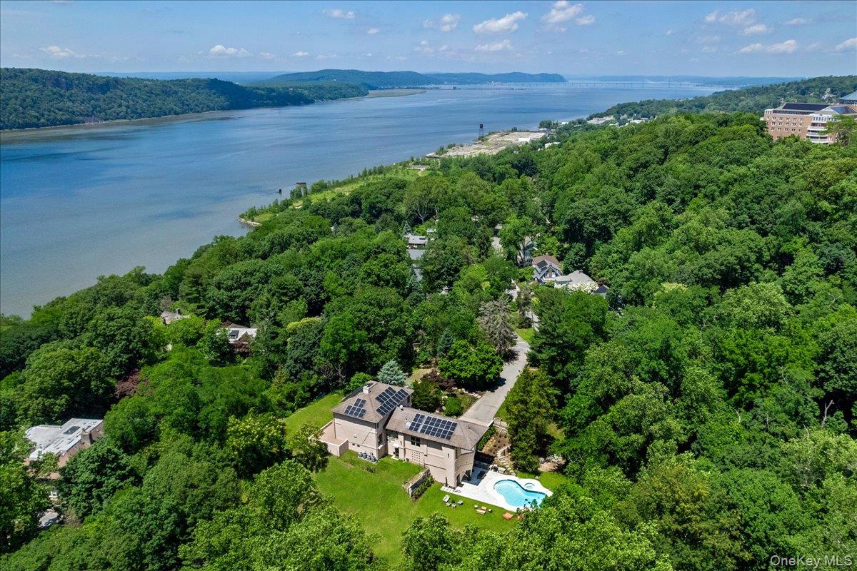 Set on over two acres of beautifully curated private grounds, Architec...