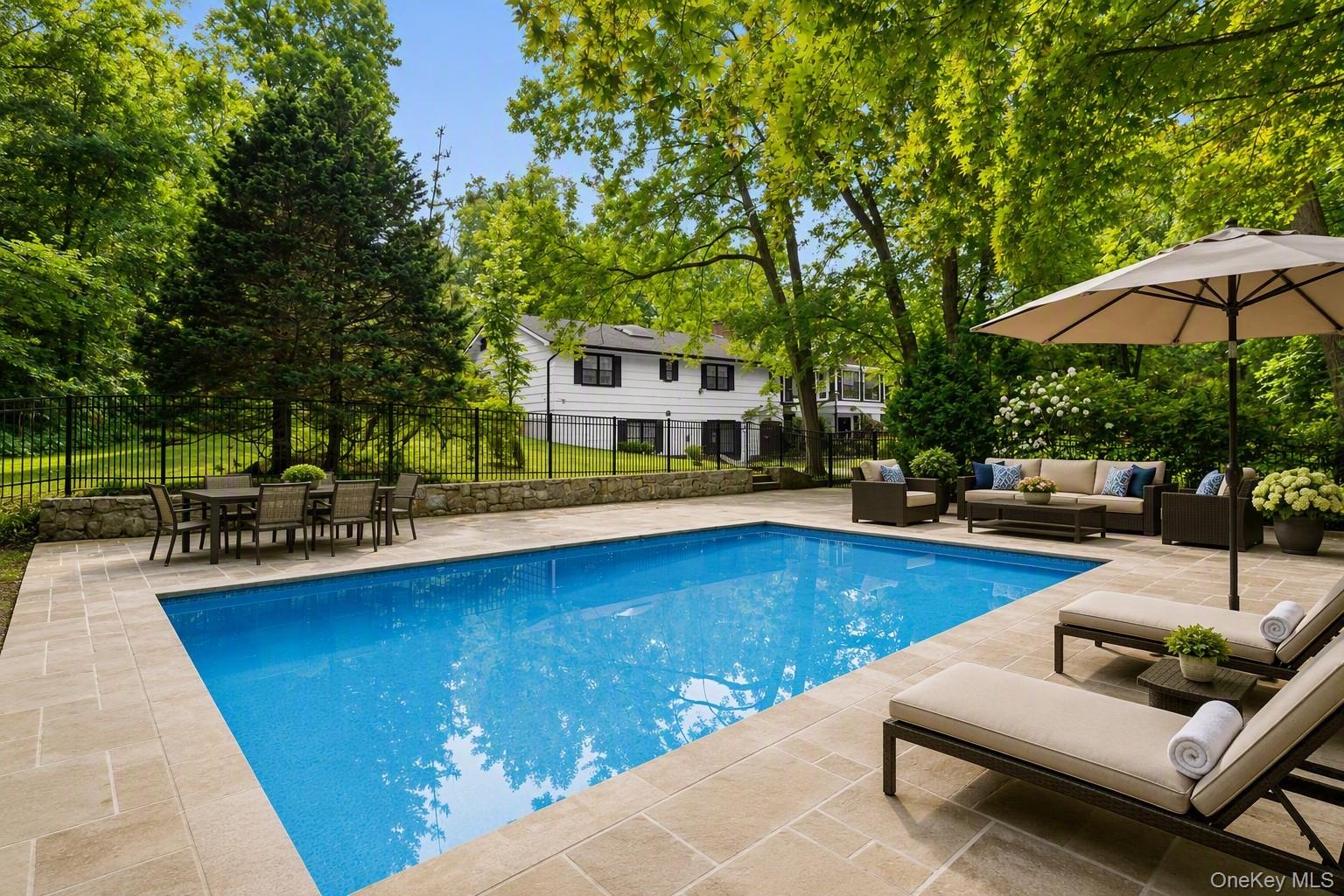 Katonah, swim at your private oasis, this multi-functional home with i...