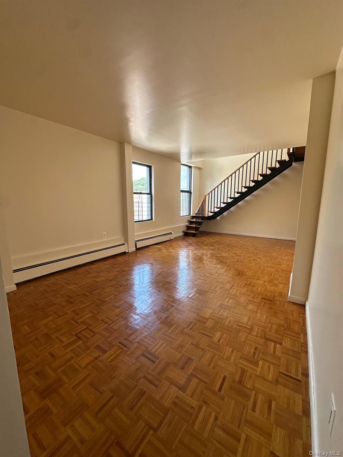 sun drenched newly renovated duplex apartment hardwood flooring throug...