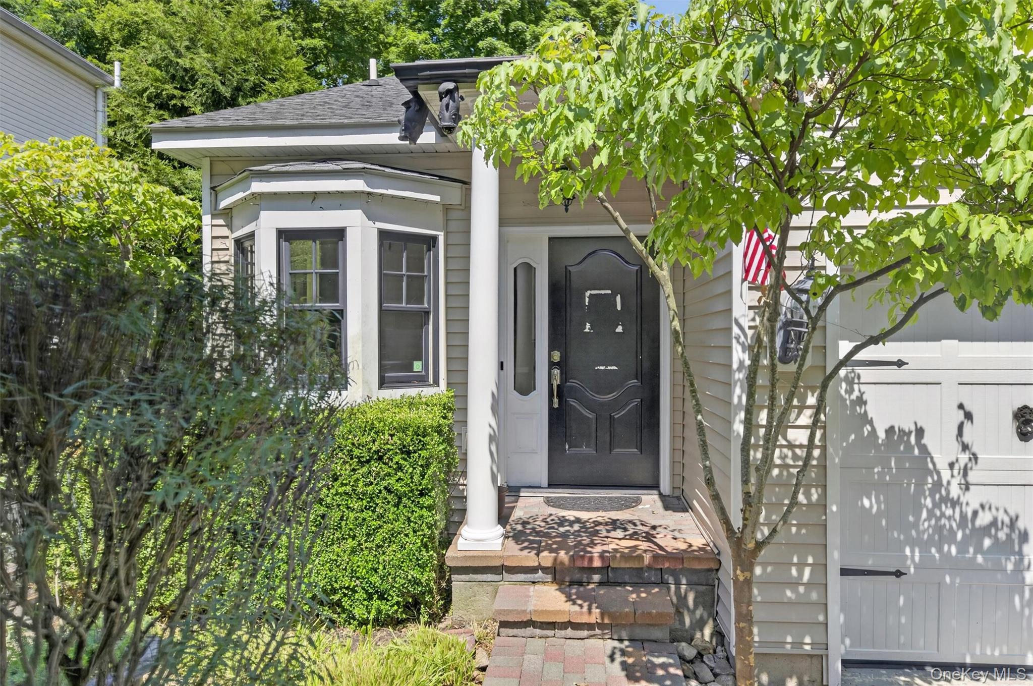 Welcome to this charming two-bedroom, one-and-a-half-bath Colonial nes...