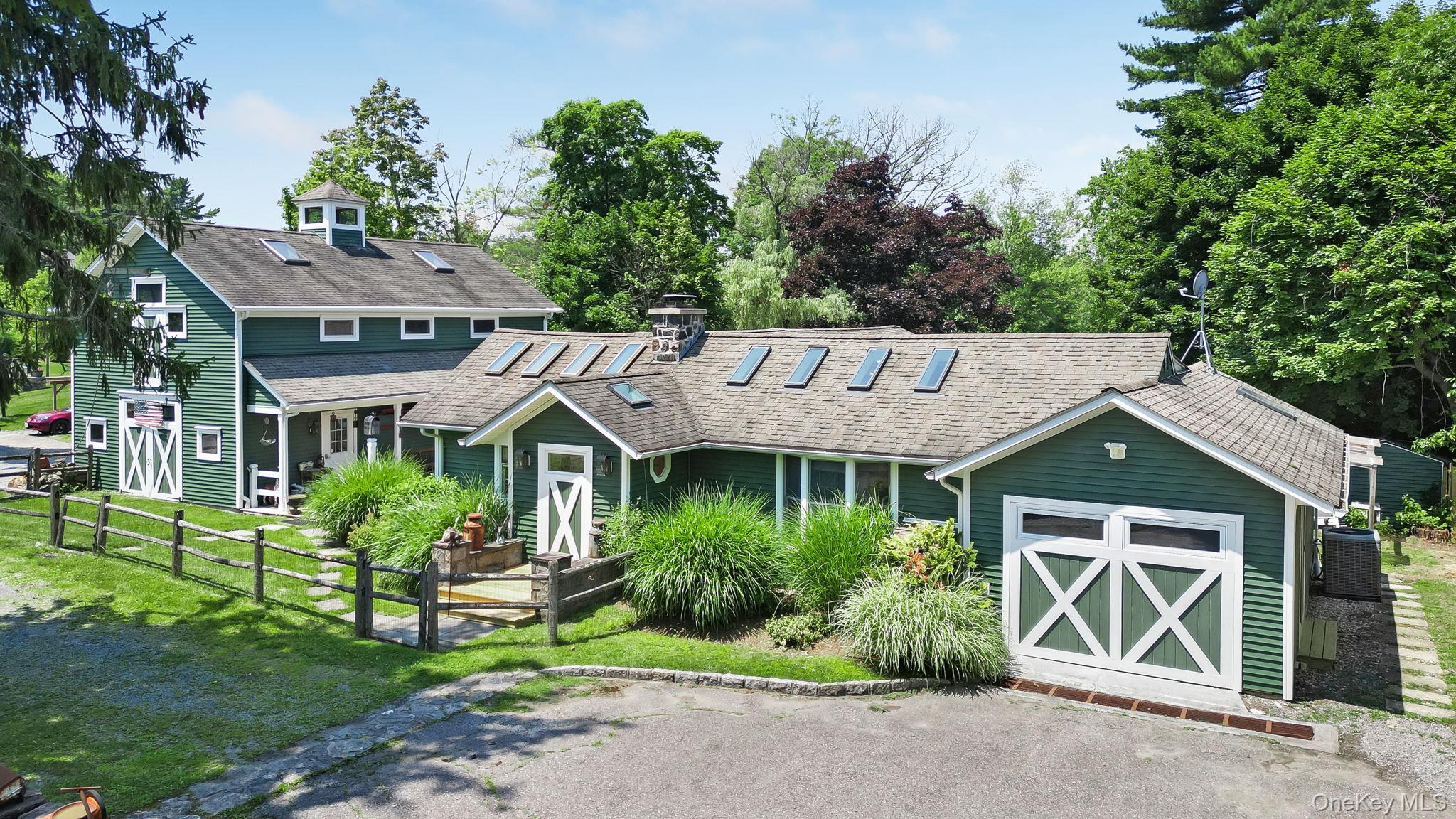 Welcome to an extraordinary custom-renovated farm house ranch in the h...