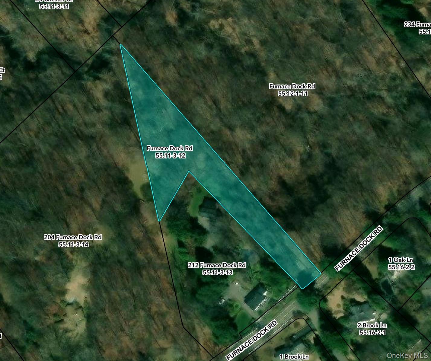 Private 1.4-acre flag lot in Cortlandt Manor offering a peaceful natur...