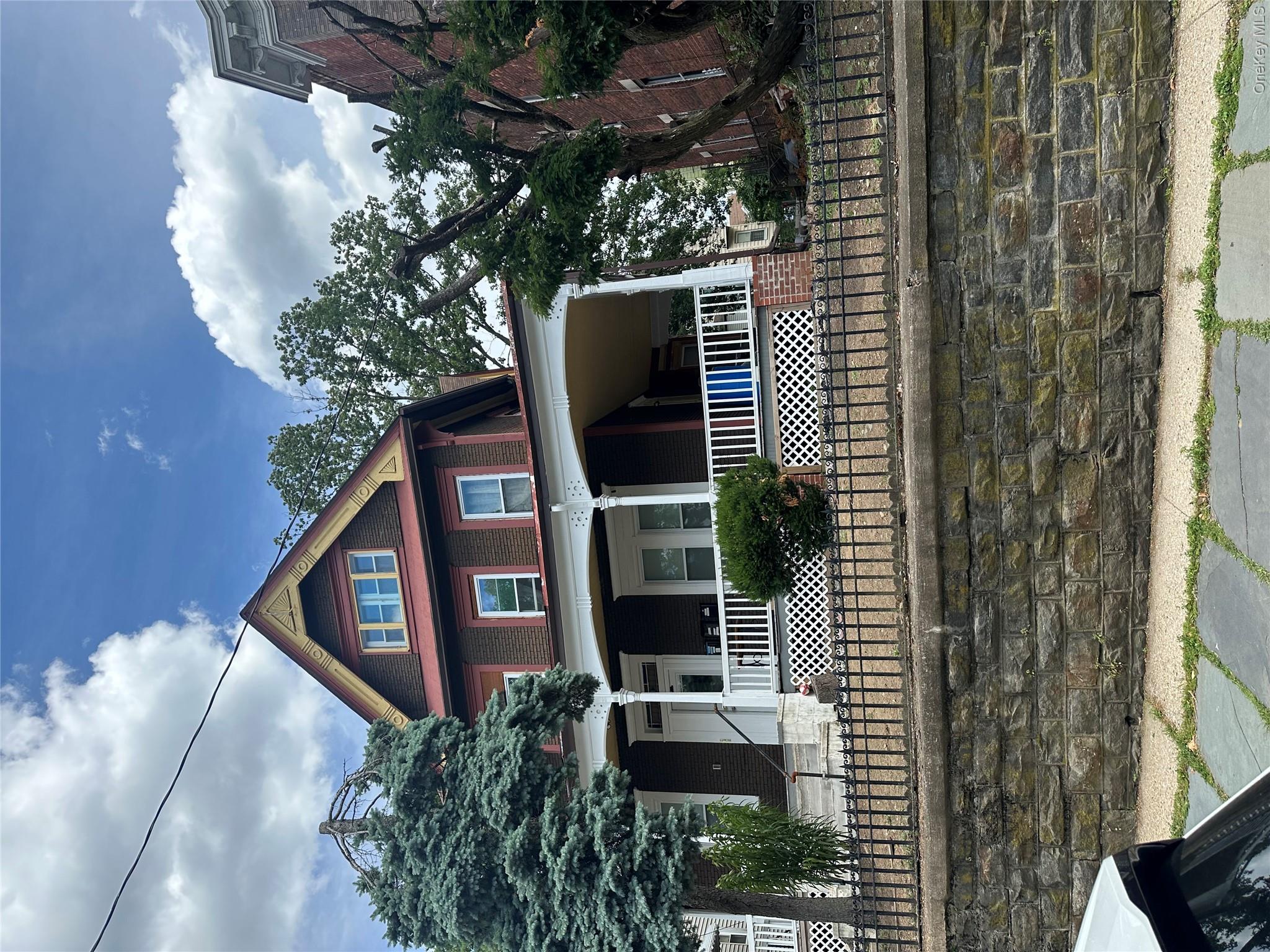 This spacious three-family home features three 2-bedroom apartments, o...