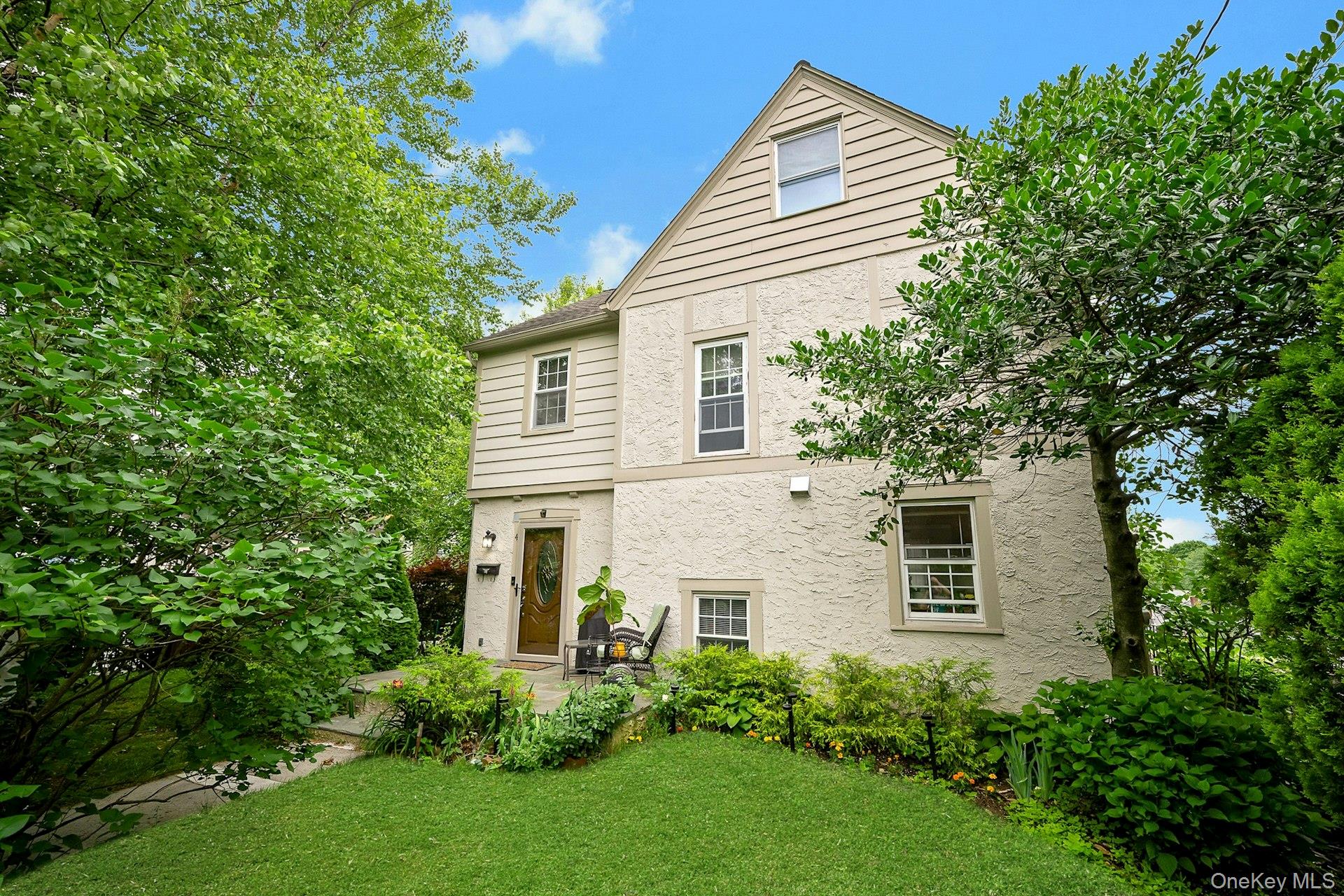 Welcome to this charming home on a beautiful tree-lined dead-end stree...