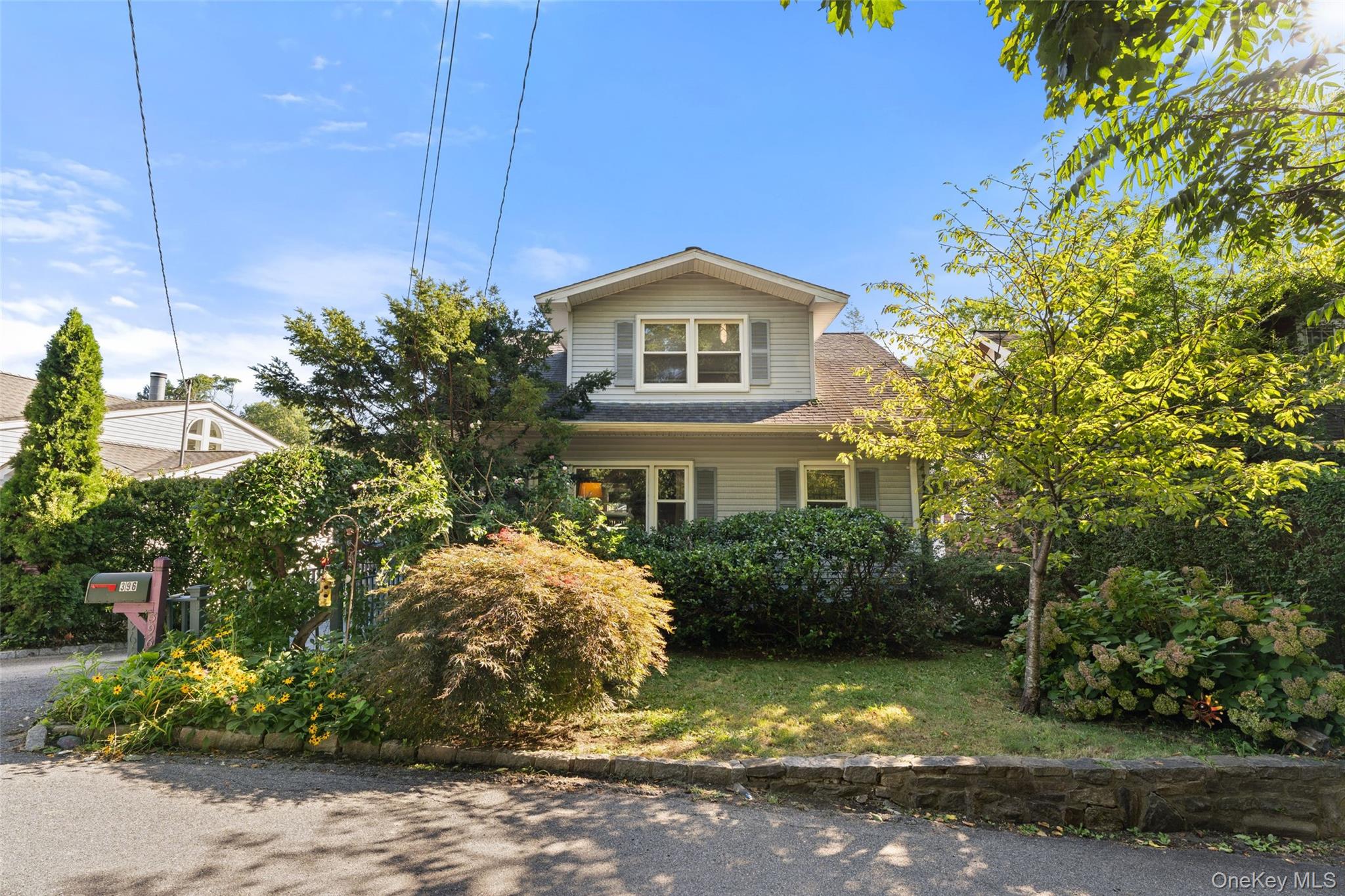 Nestled in picturesque Hastings-on-Hudson, this 1924 charmer is brimmi...