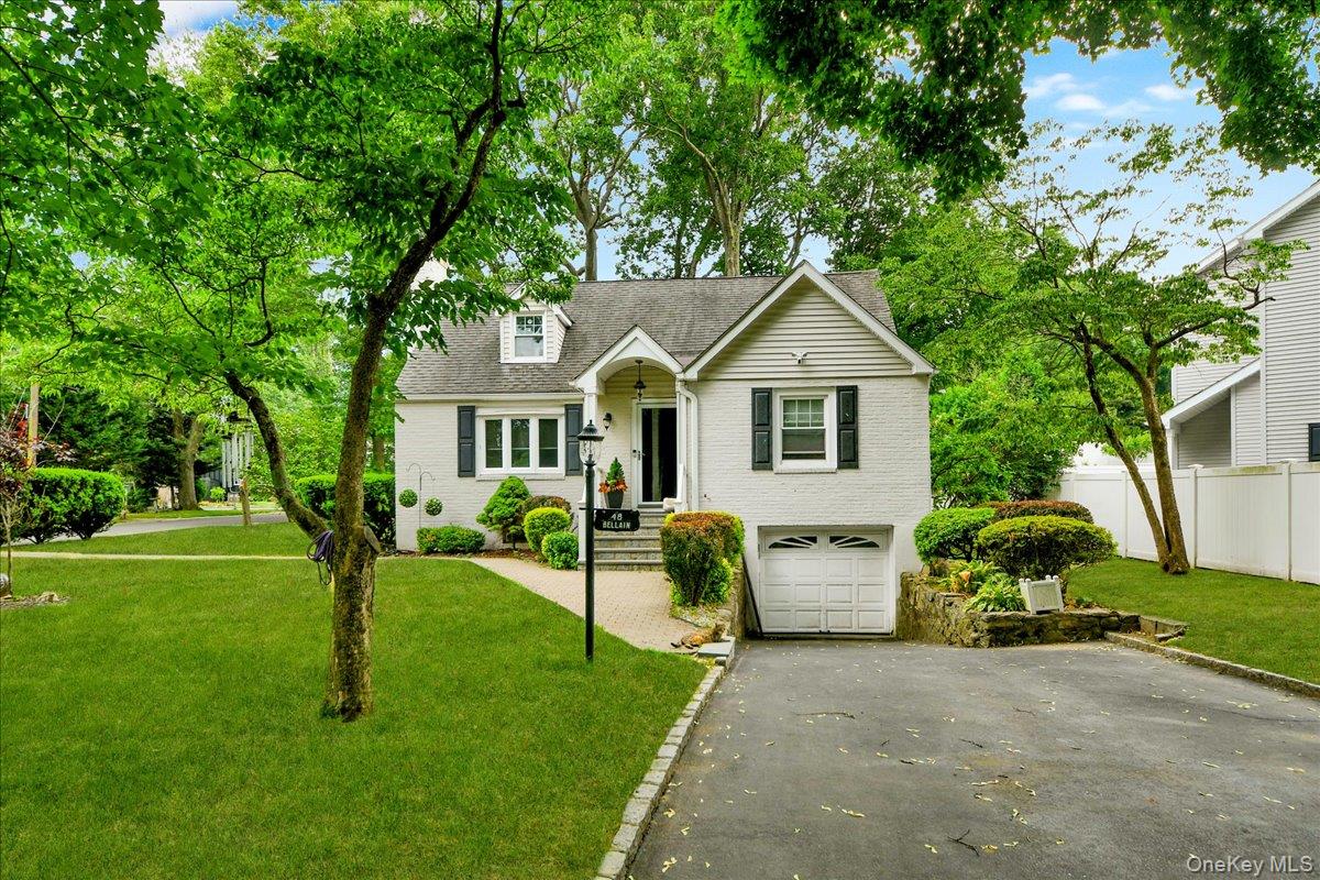 WELCOME HOME!! This charming brick Cape Cod with Colonial-inspired det...