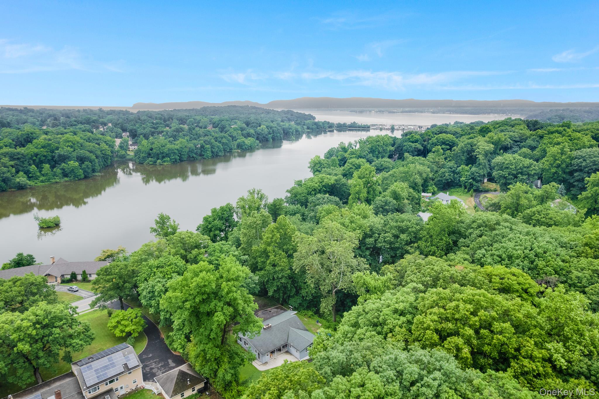 A truly one-of-a-kind offering, this solid brick ranch is set on an ex...