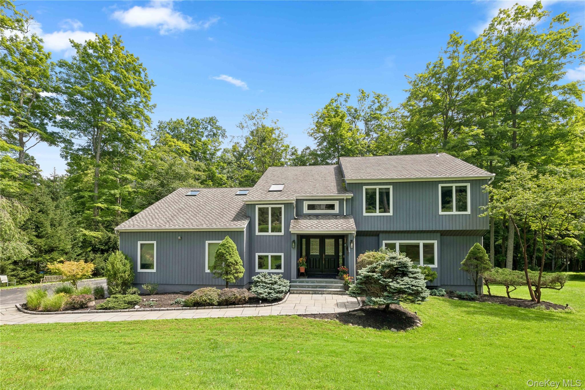 Sited on 1.83 peaceful, wooded acres, this beautiful 4-bedroom, 3.5-ba...