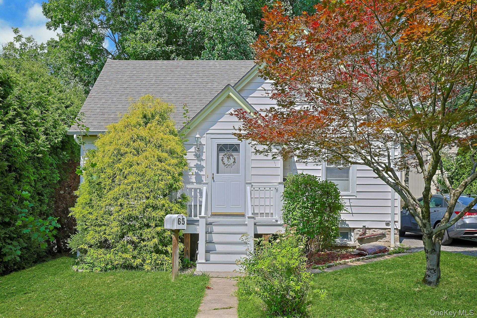 Welcome to 65 Laurel Place! Nestled in a quiet neighborhood in the hea...