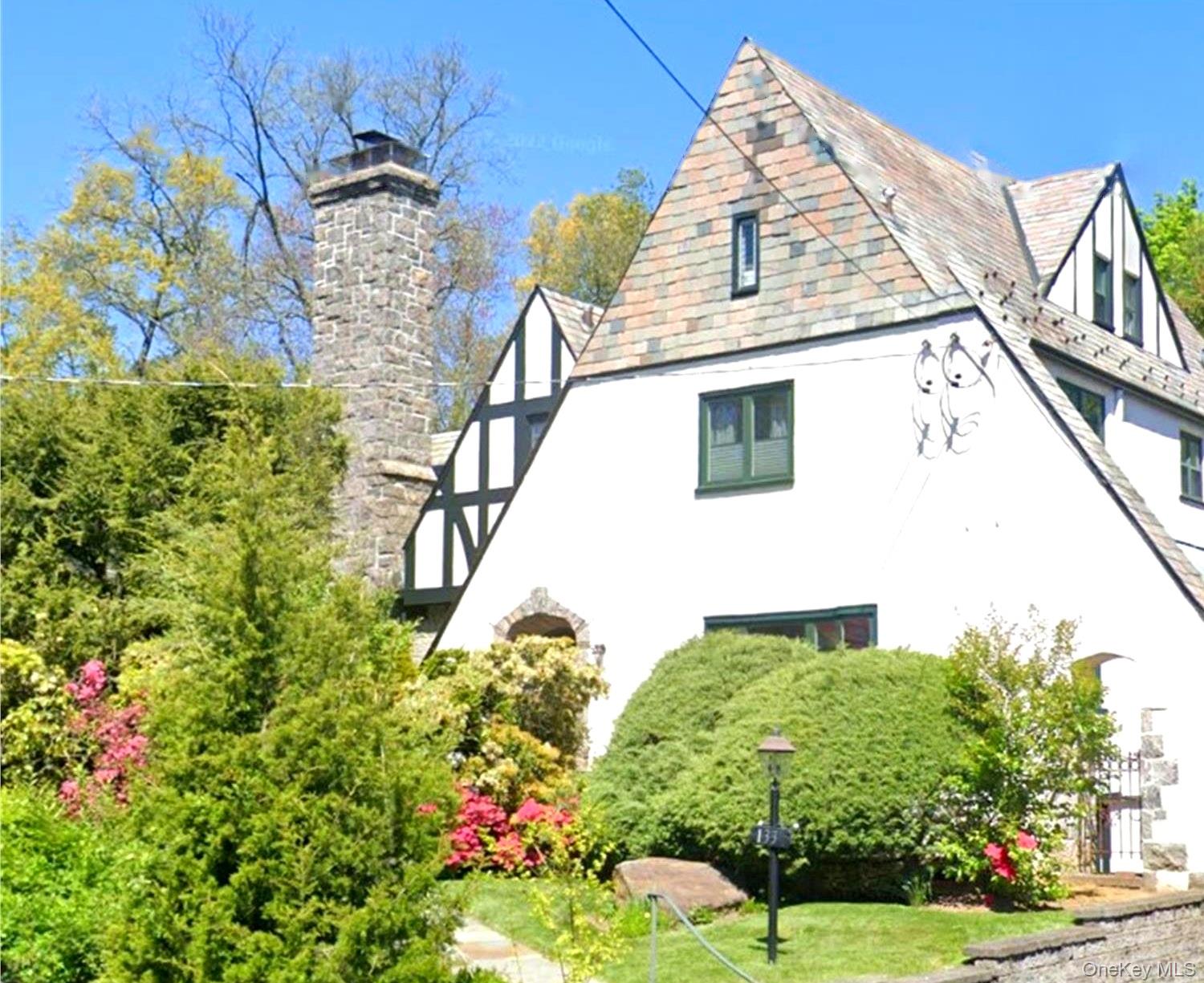 **Timeless Tudor Elegance in the Heart of Wykagyl**

Tucked away at th...