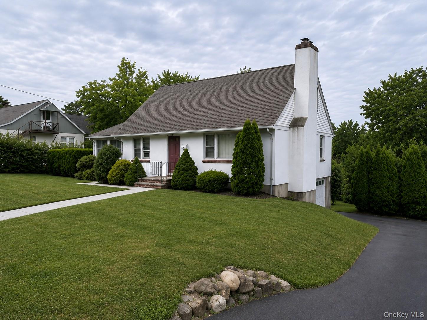 Charming Cape Cod-style home, lovingly maintained and beautifully situ...