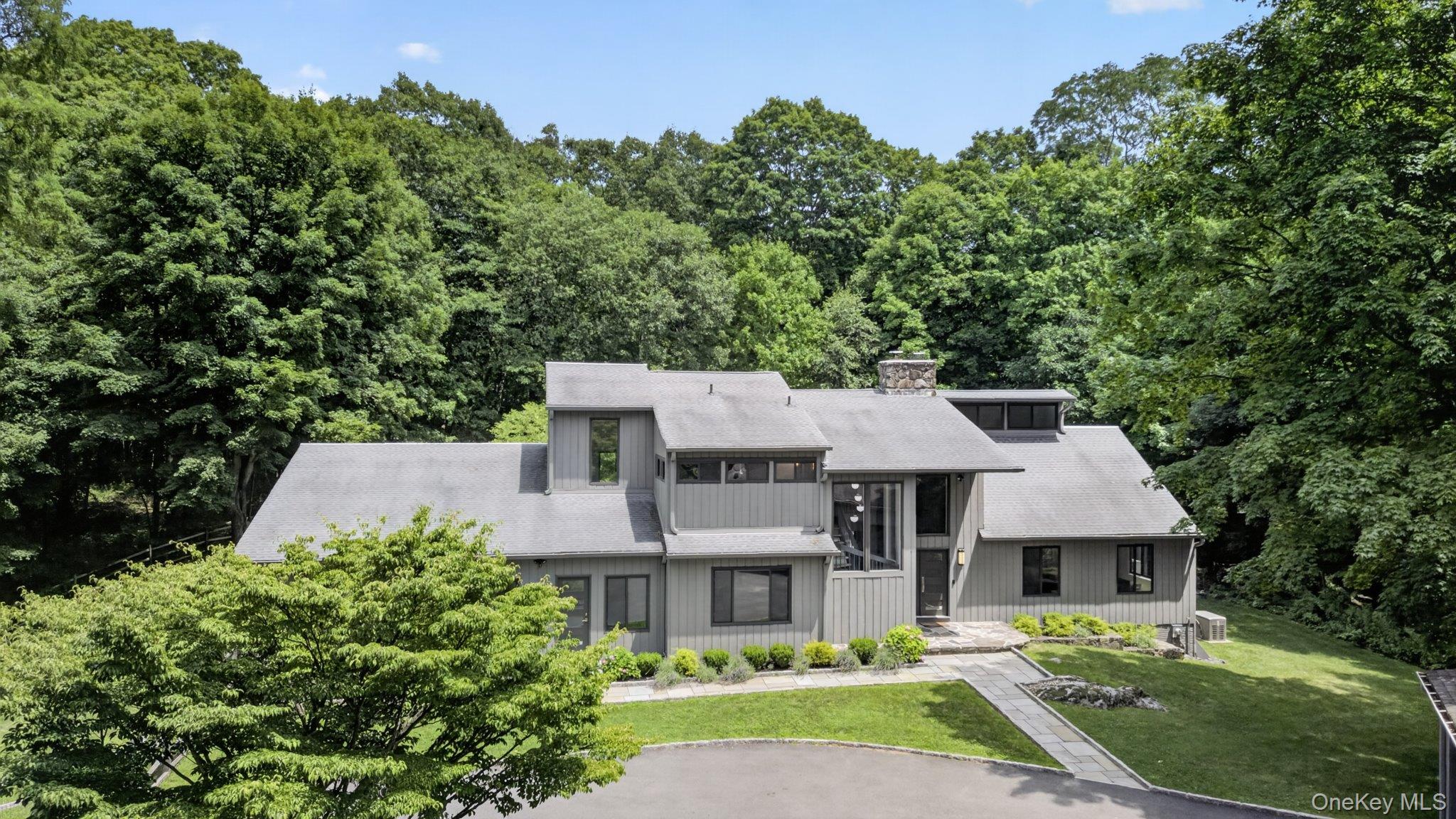 Perfectly situated on one of Bedford's quintessential country roads, t...