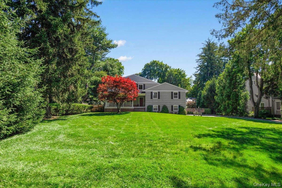 Beautifully renovated split-level home with a charming front porch in...