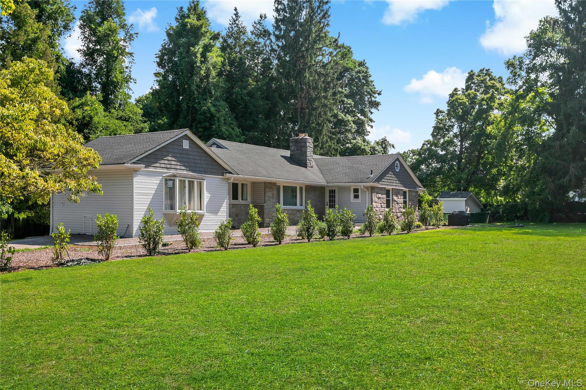 Beautifully set on a level, fully usable 2-acre property in one of Arm...