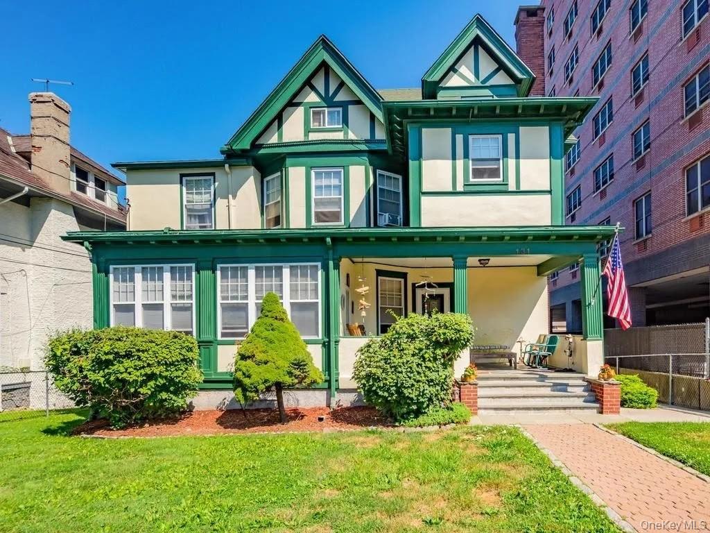 Well-maintained three-family home in New Rochelle offering an excellen...