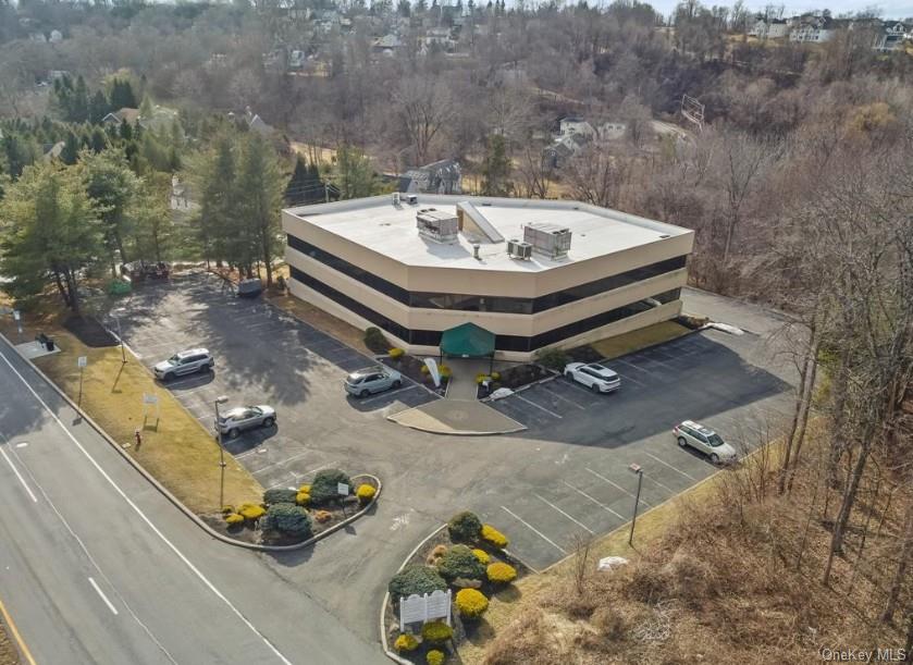 A premier three-story office building with elevator access and ample p...
