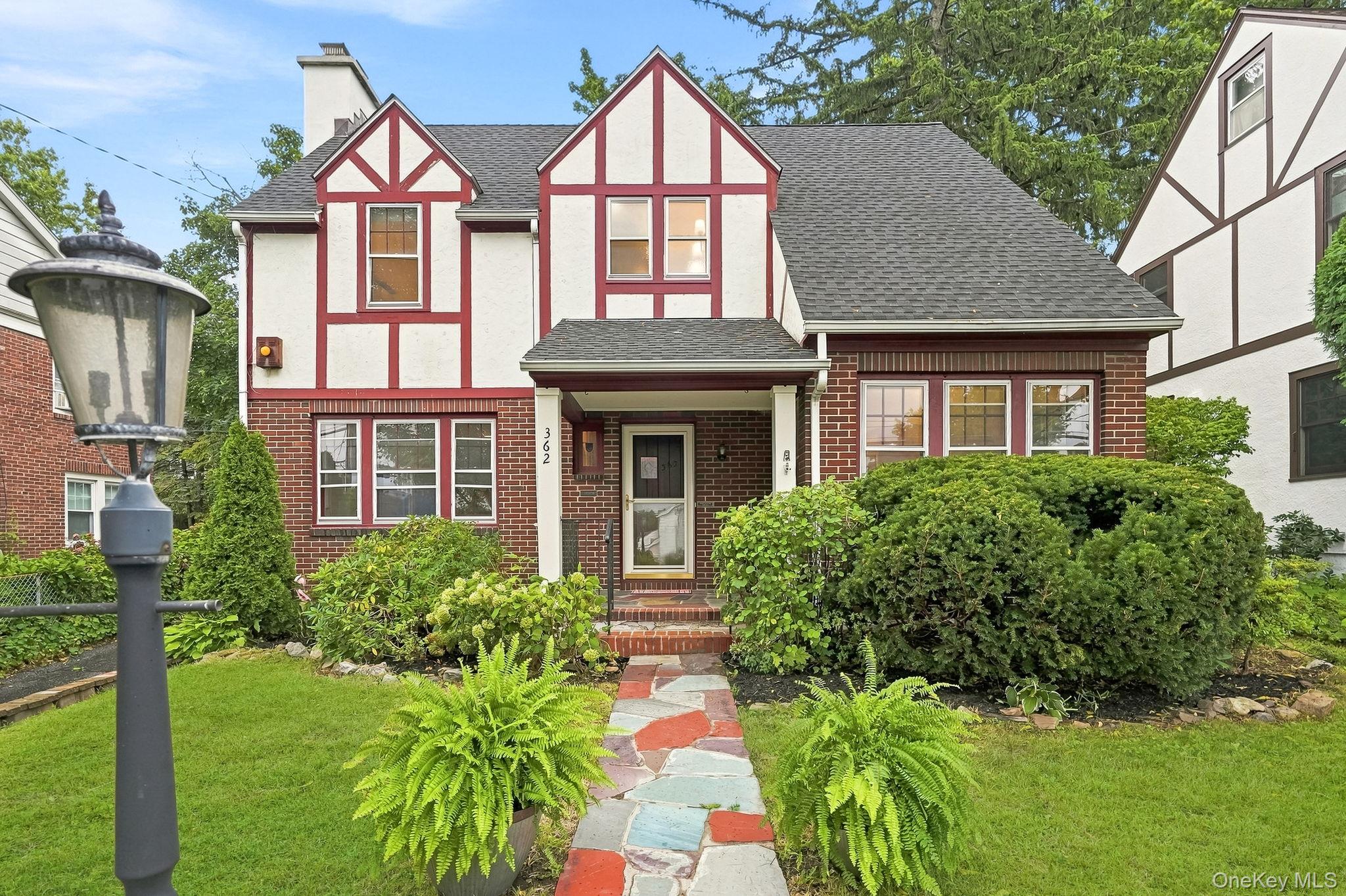 This sun-filled Tudor is a blend of historic architectural details lik...