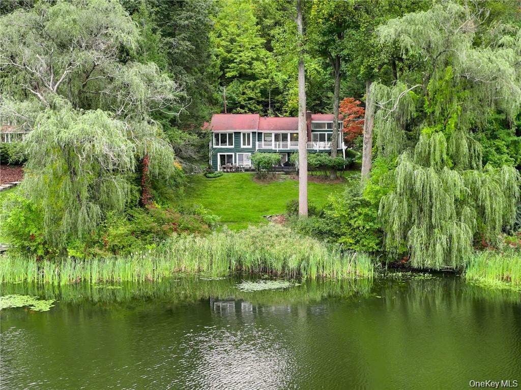 Magical park-like setting! Beautiful expanded ranch located directly o...