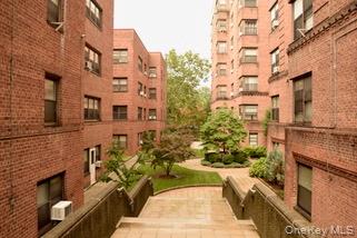 A bright, garden-level one-bedroom unit in a cooperative building feat...
