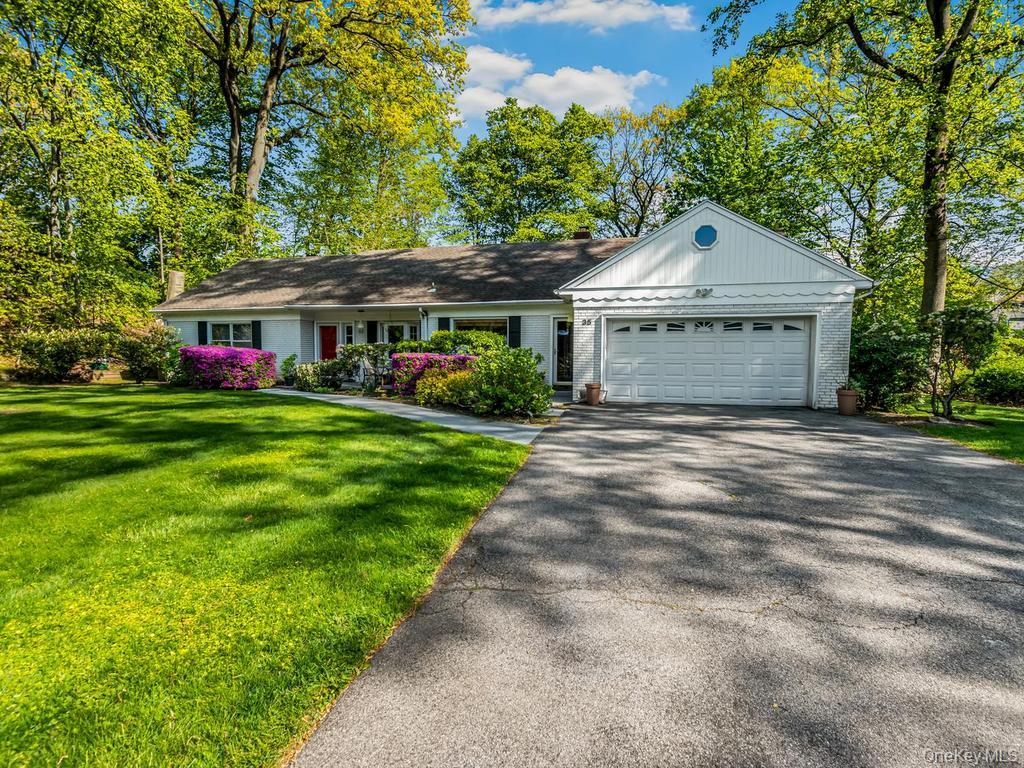 Nestled in the Beechmont Woods neighborhood of New Rochelle, this thre...