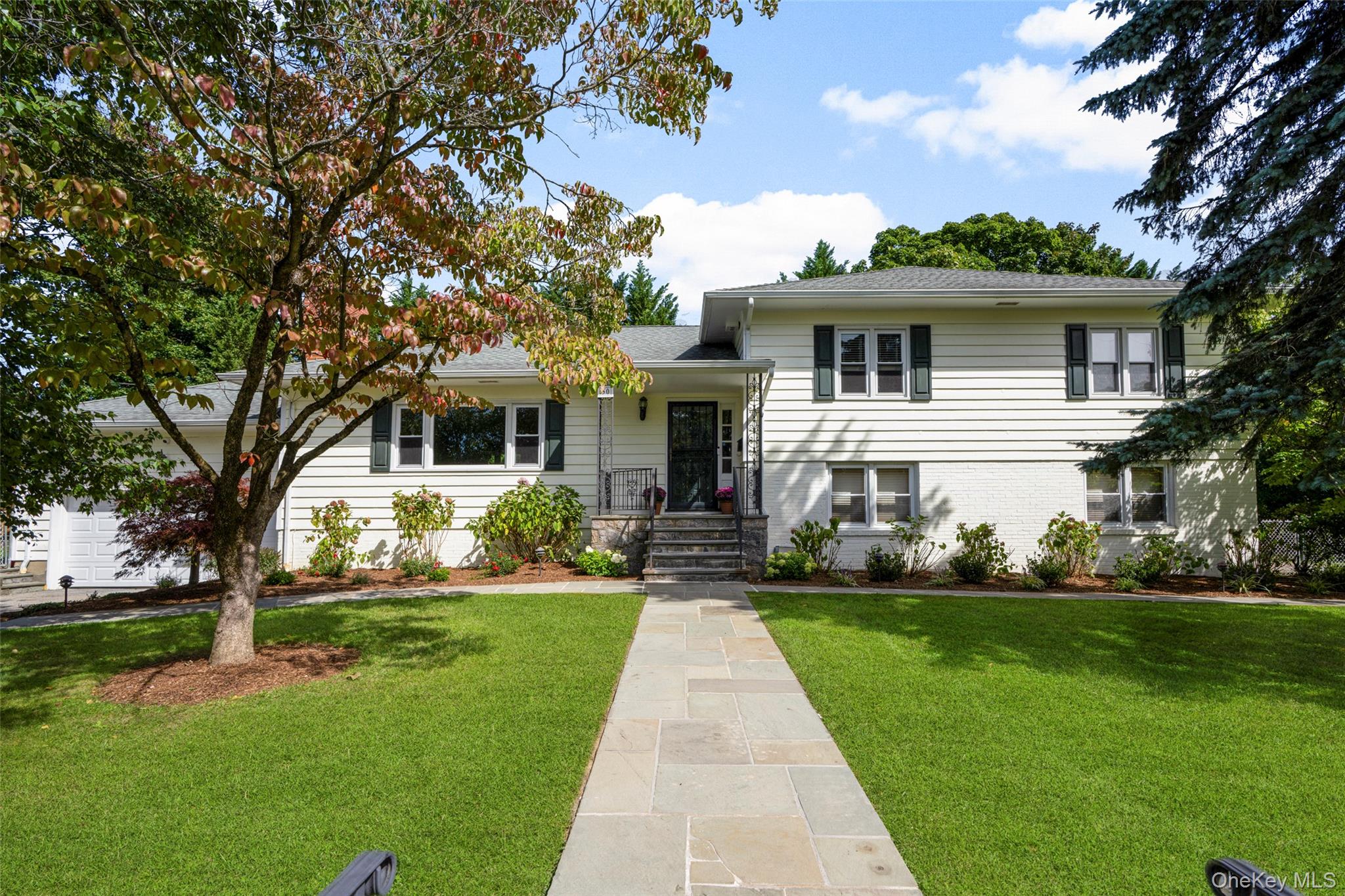 Set on a fabulous corner property with beautiful grounds in the highly...