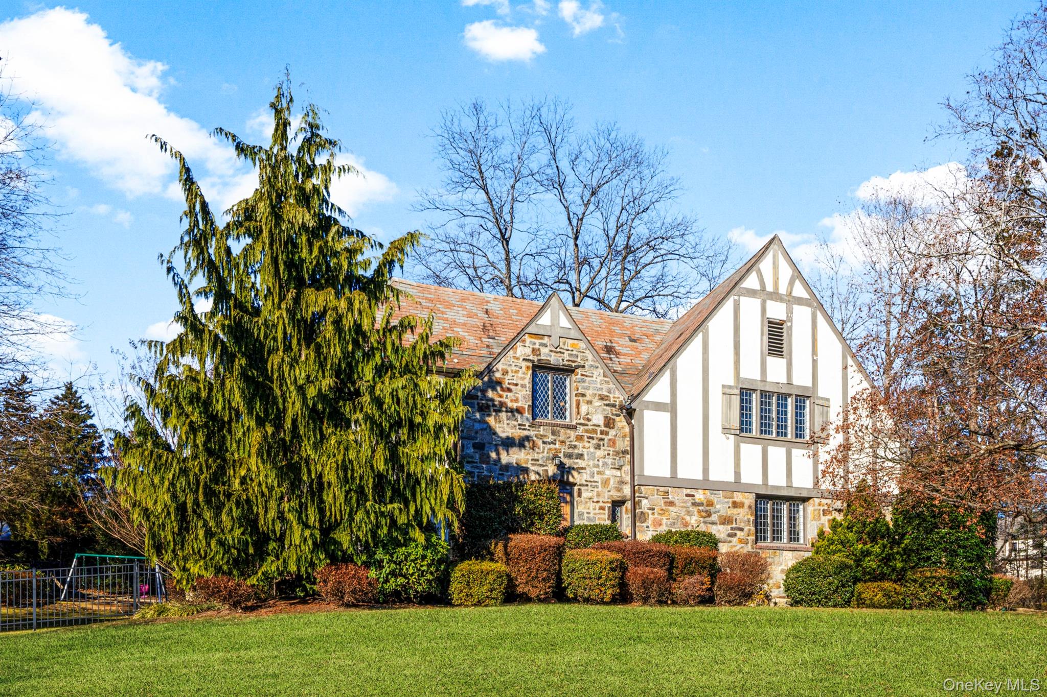 Welcome to 22 Verdun, a stately Tudor in New Rochelle's sought-after B...