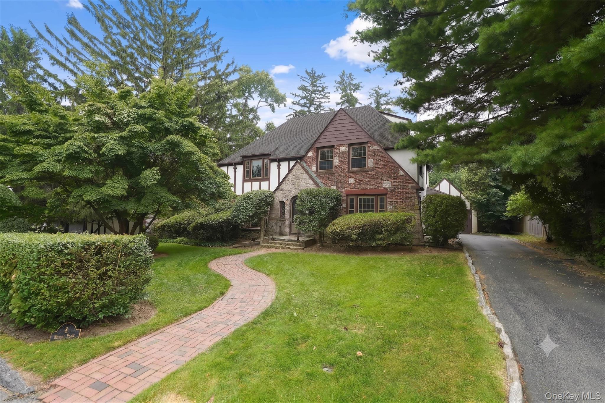 Discover timeless elegance in this charming Tudor-style home, characte...
