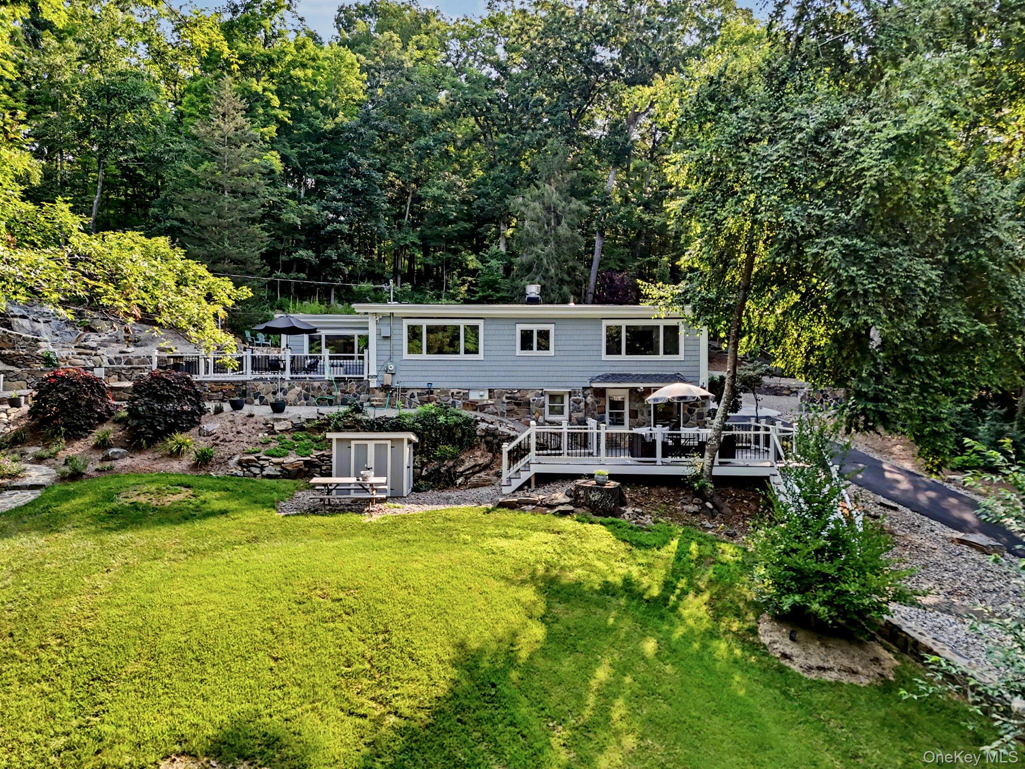 Completely reimagined and set on nearly 5 private acres, this stunning...