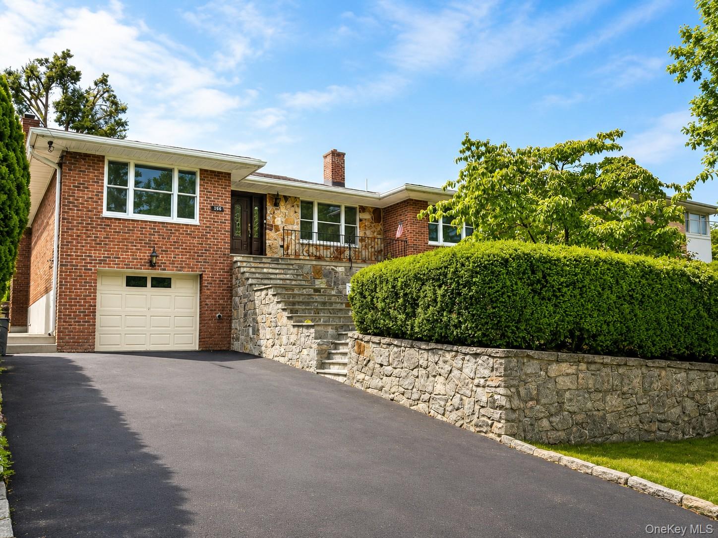 Welcome to this quality custom-built brick home situated on a well-mai...