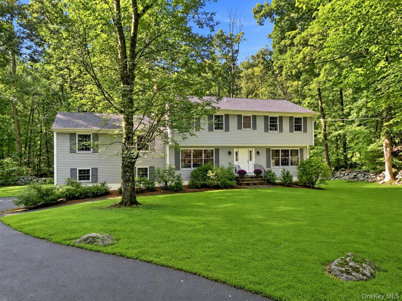 Welcome home to a meticulously maintained center hall colonial home se...