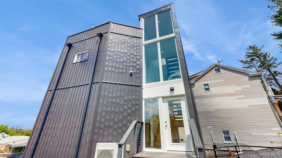 Experience modern living in this unique tri-level single-family home i...